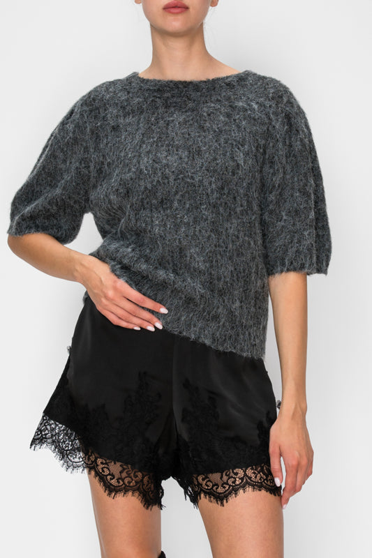 Close-up of black lace-detail boxer shorts