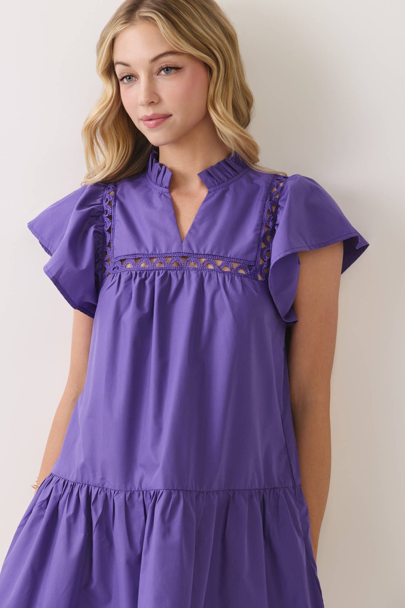 Purple mini dress with flutter sleeves and ruffle collar