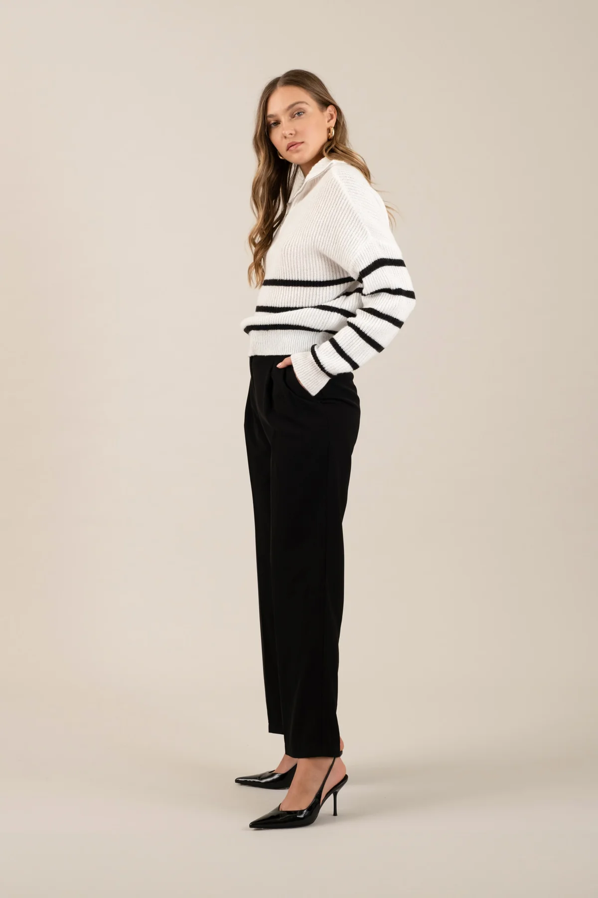 Black pleated wide-leg trousers, side view