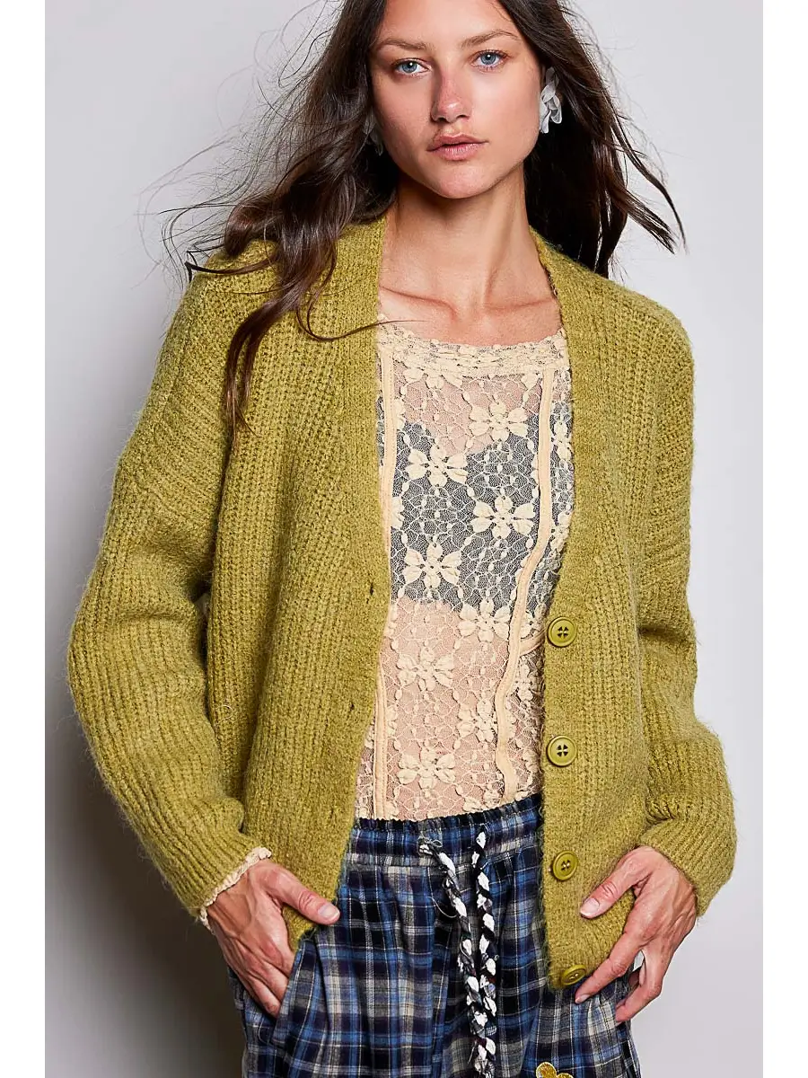 Green V-neck button-front cardigan on model, front view