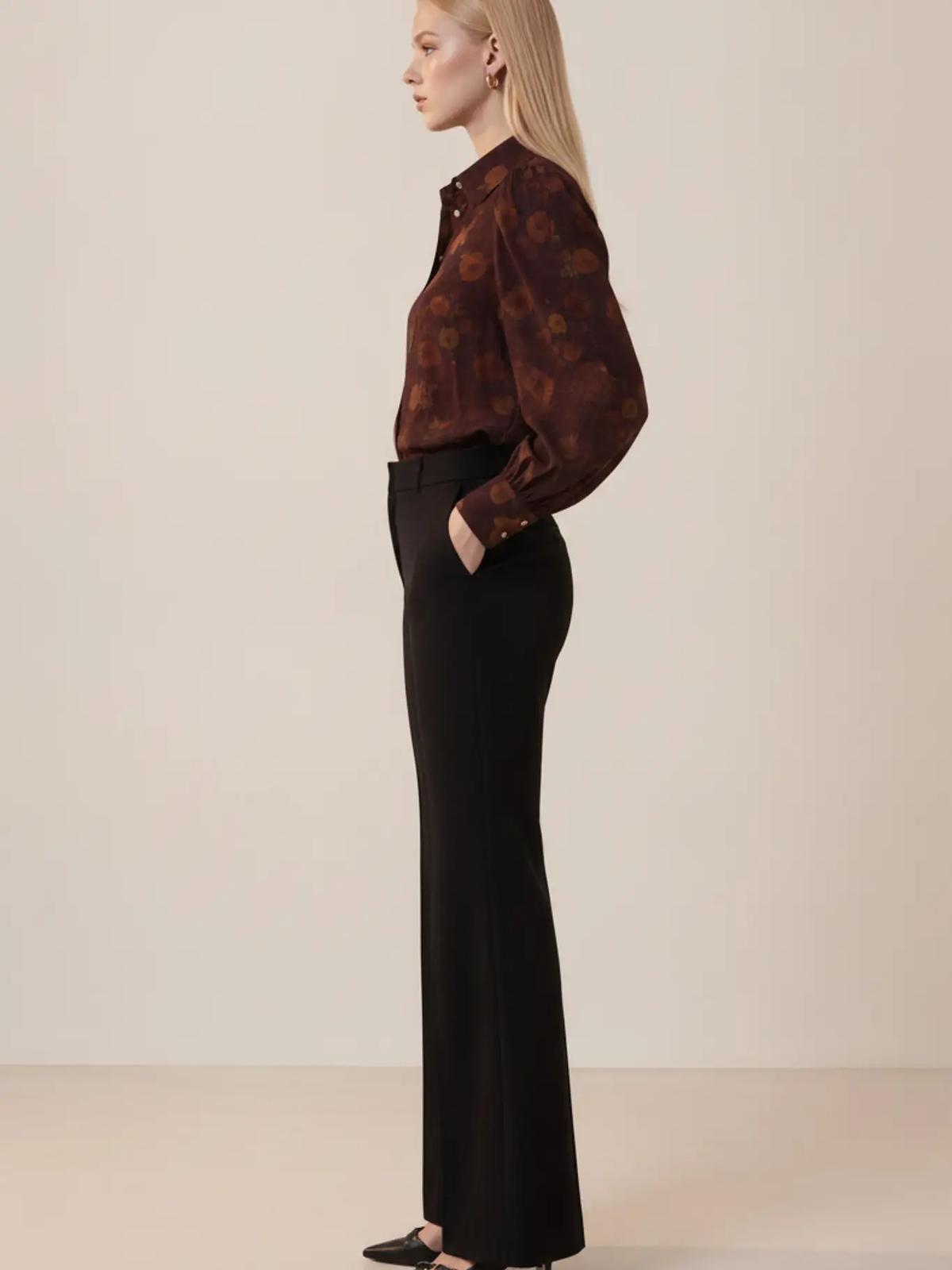 Burgundy floral blouse side view styled with black trousers