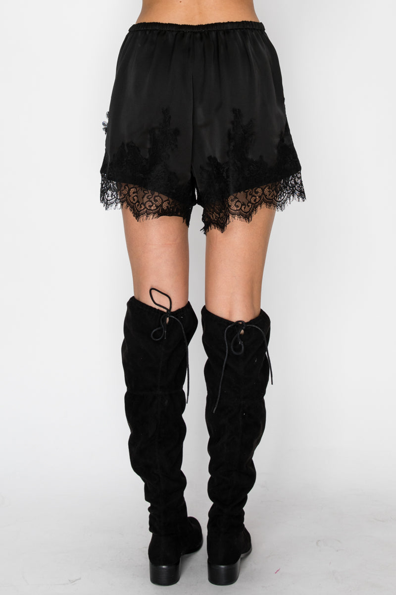 Black boxer-inspired shorts with delicate lace detailing
