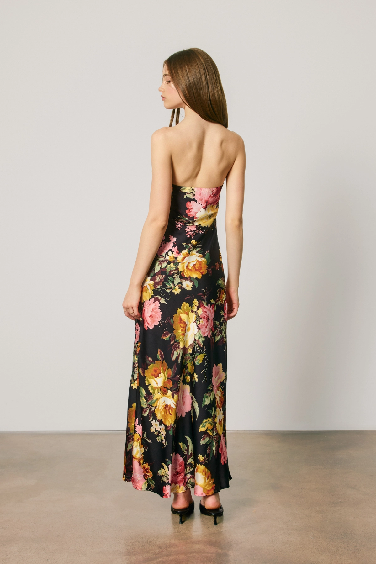 Watercolor floral detail on black maxi dress