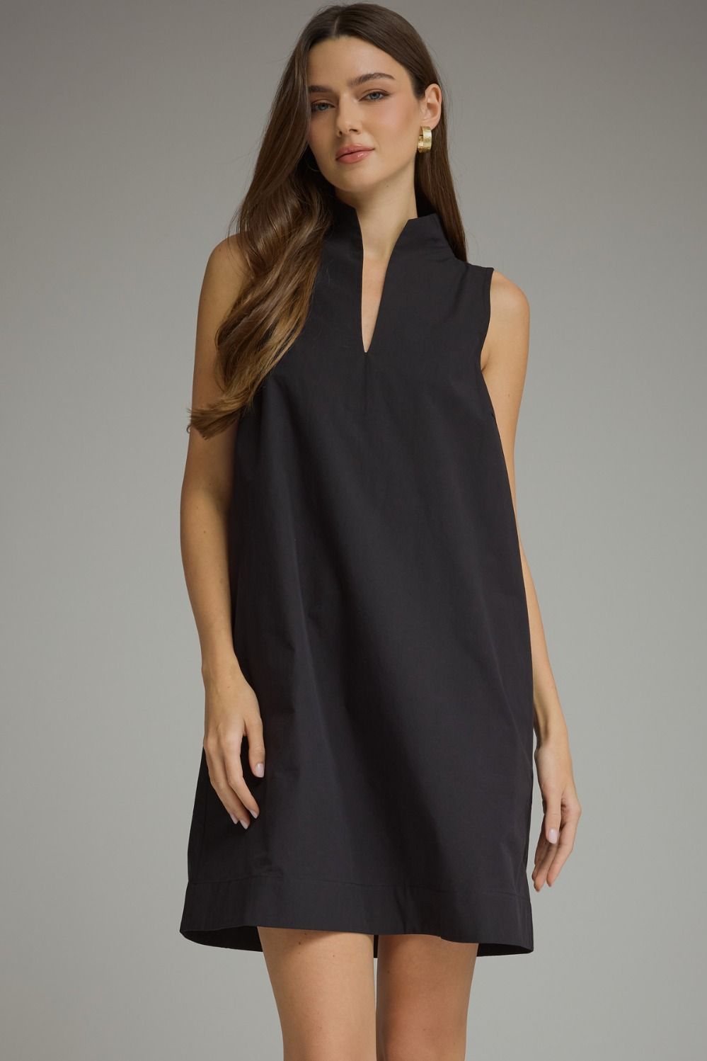 Black sleeveless split-neck mini dress with a stand collar and relaxed shift silhouette