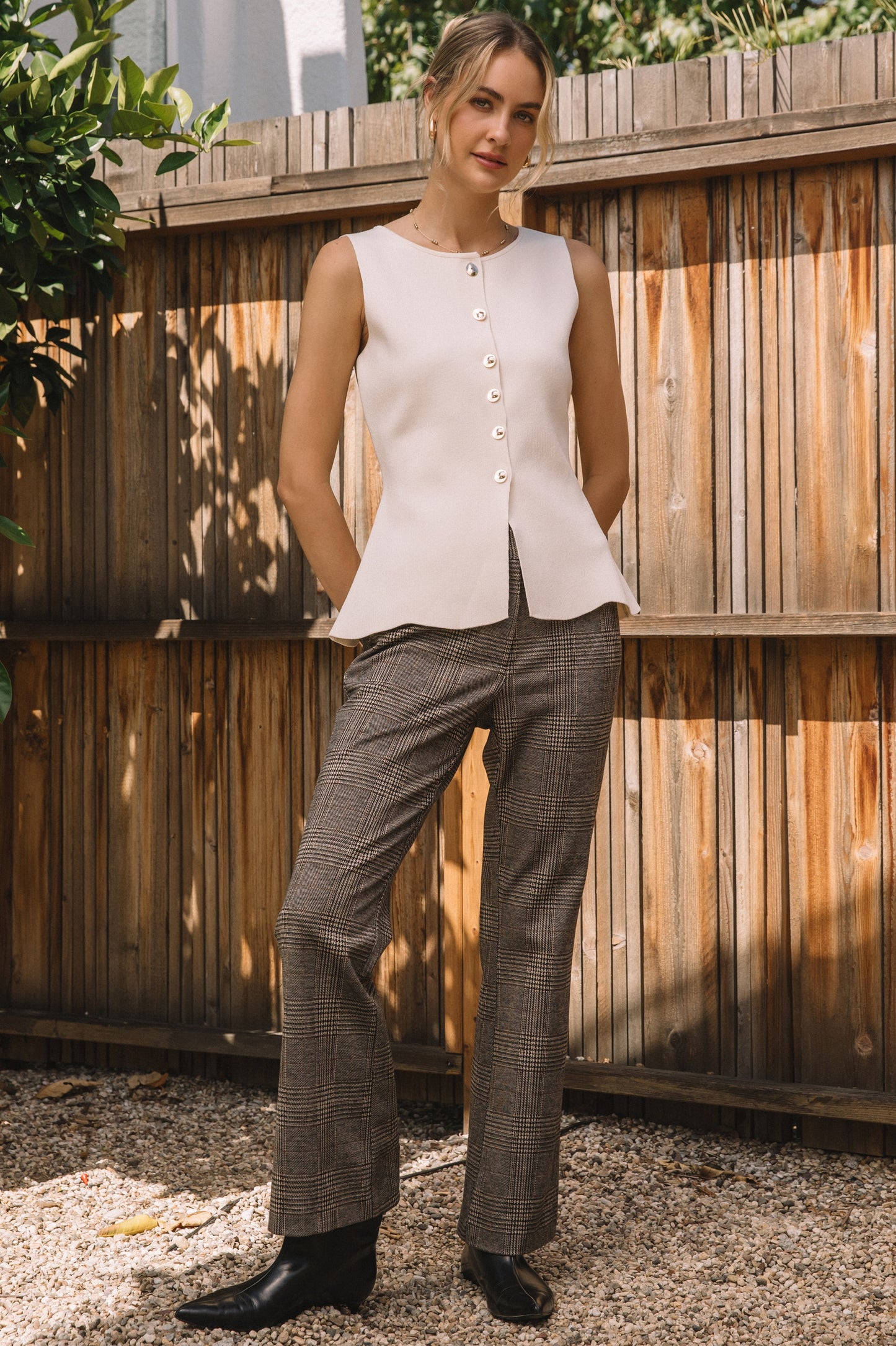 SLEEVELESS KNIT PEPLUM TOP