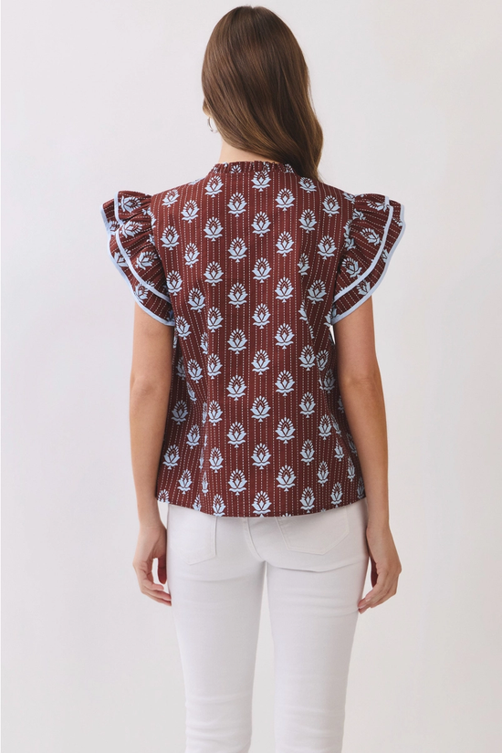 Brown floral blouse with ruffle collar and contrast piping