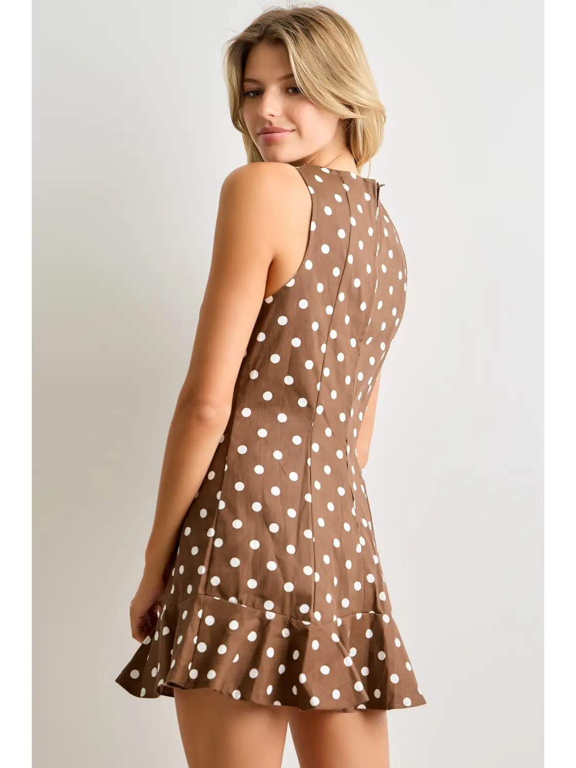 Brown polka-dot mini dress with flounced hem, back view