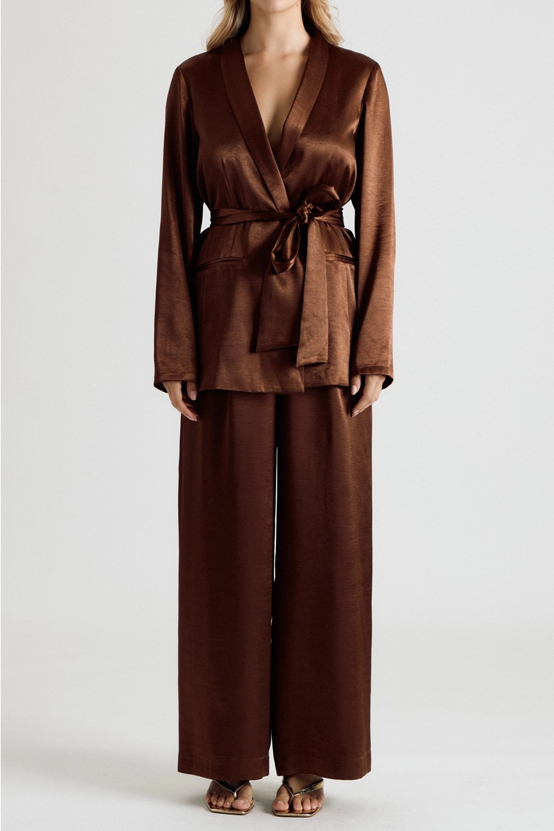 Brown satin trousers styled with matching belted blazer