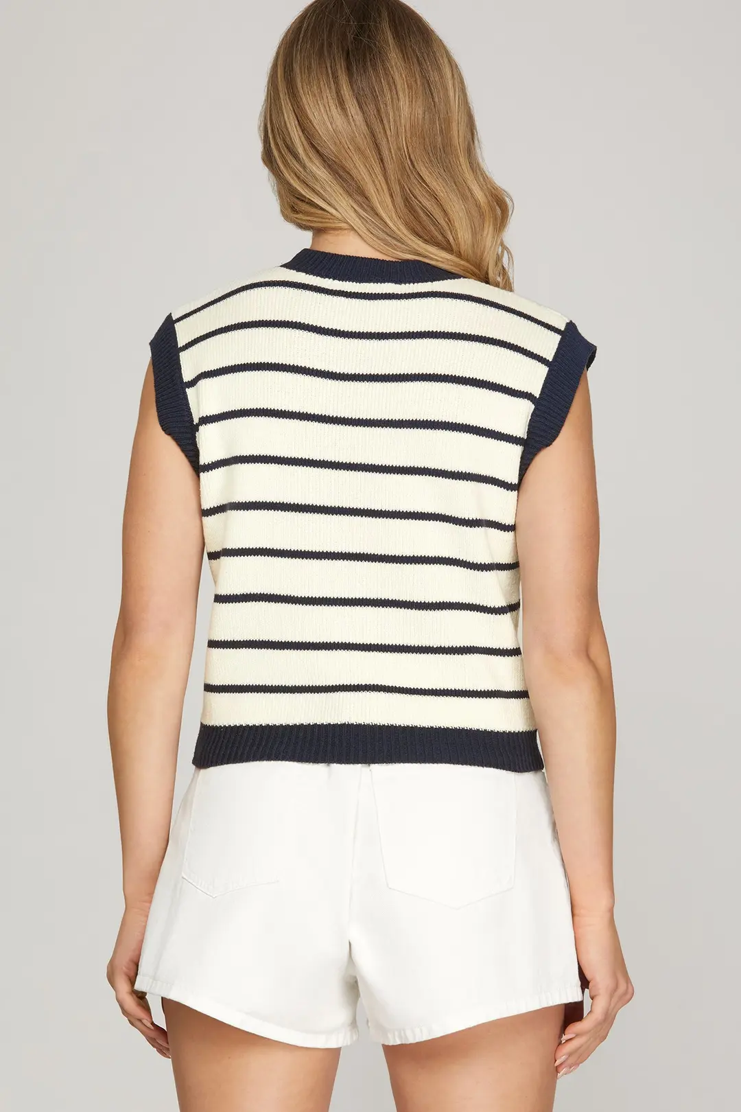 Knit stripe detail on navy sweater vest