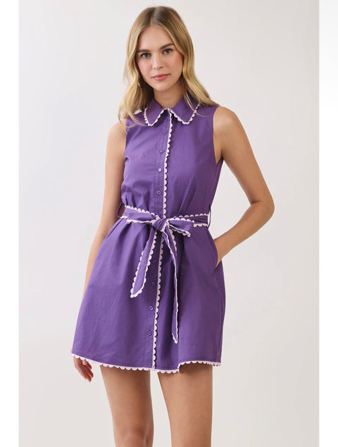 Model wearing purple scallop-trim shirt dress with self-tie belt
