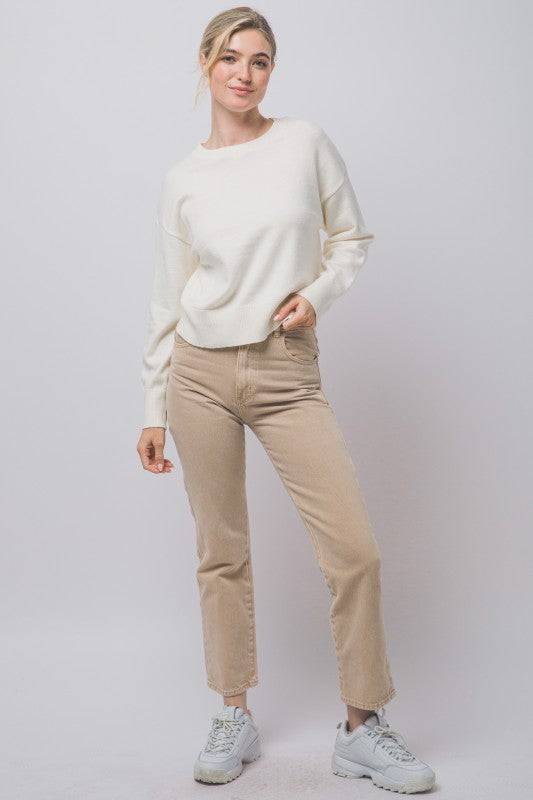 Ivory crewneck sweater full-length styled view