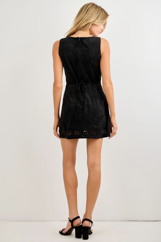 Black sleeveless laser-cut romper showing the back fit