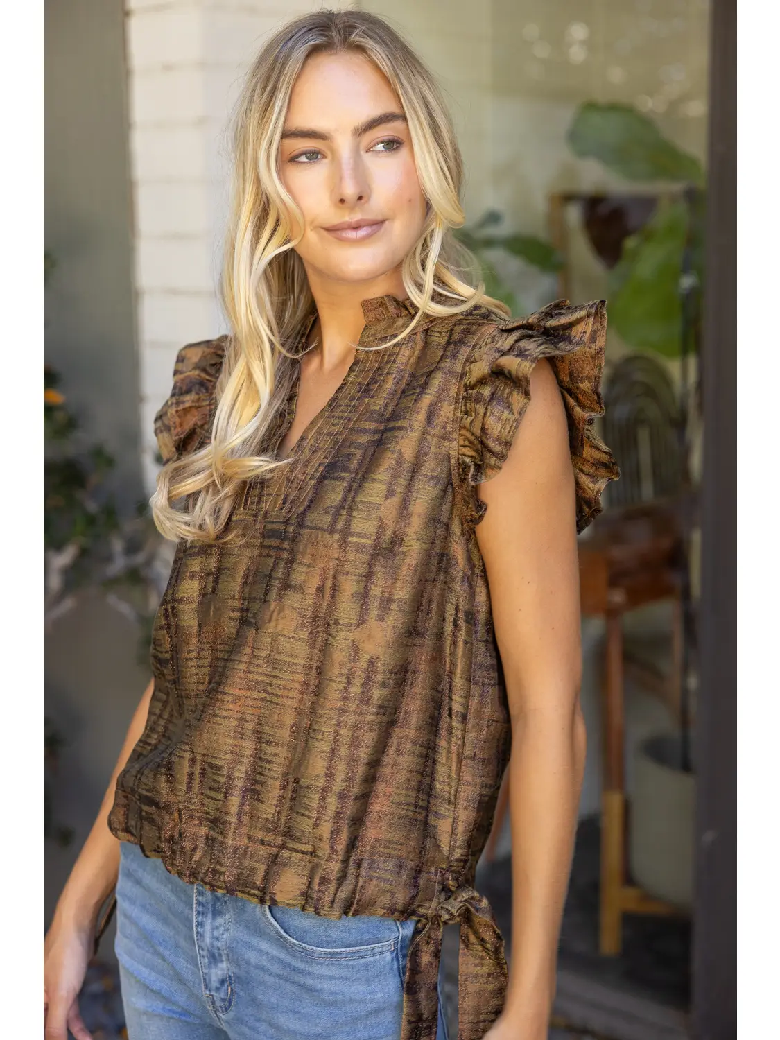 Tie-hem top showing the relaxed silhouette and side details