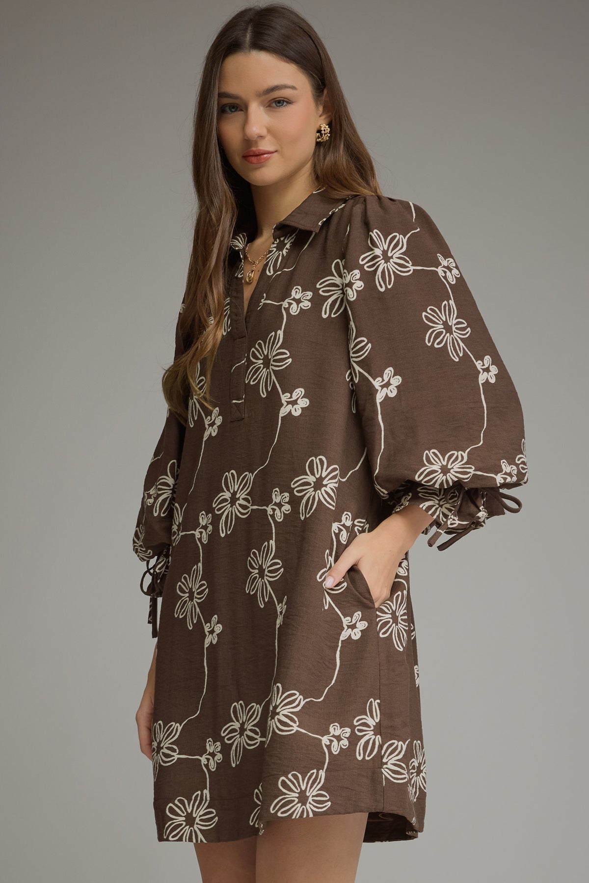 Brown floral balloon-sleeve mini dress, angled front view