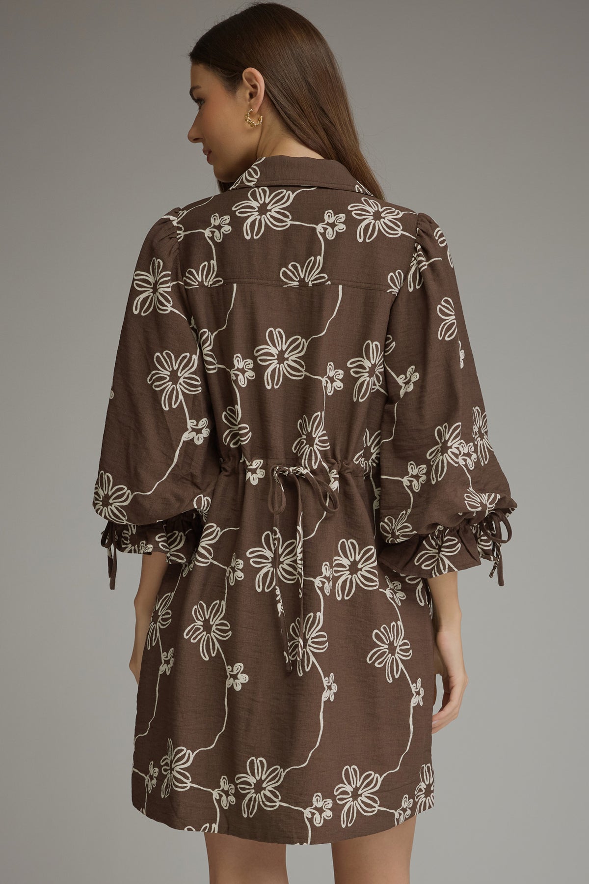 Brown floral balloon-sleeve mini dress with back waist tie, back view
