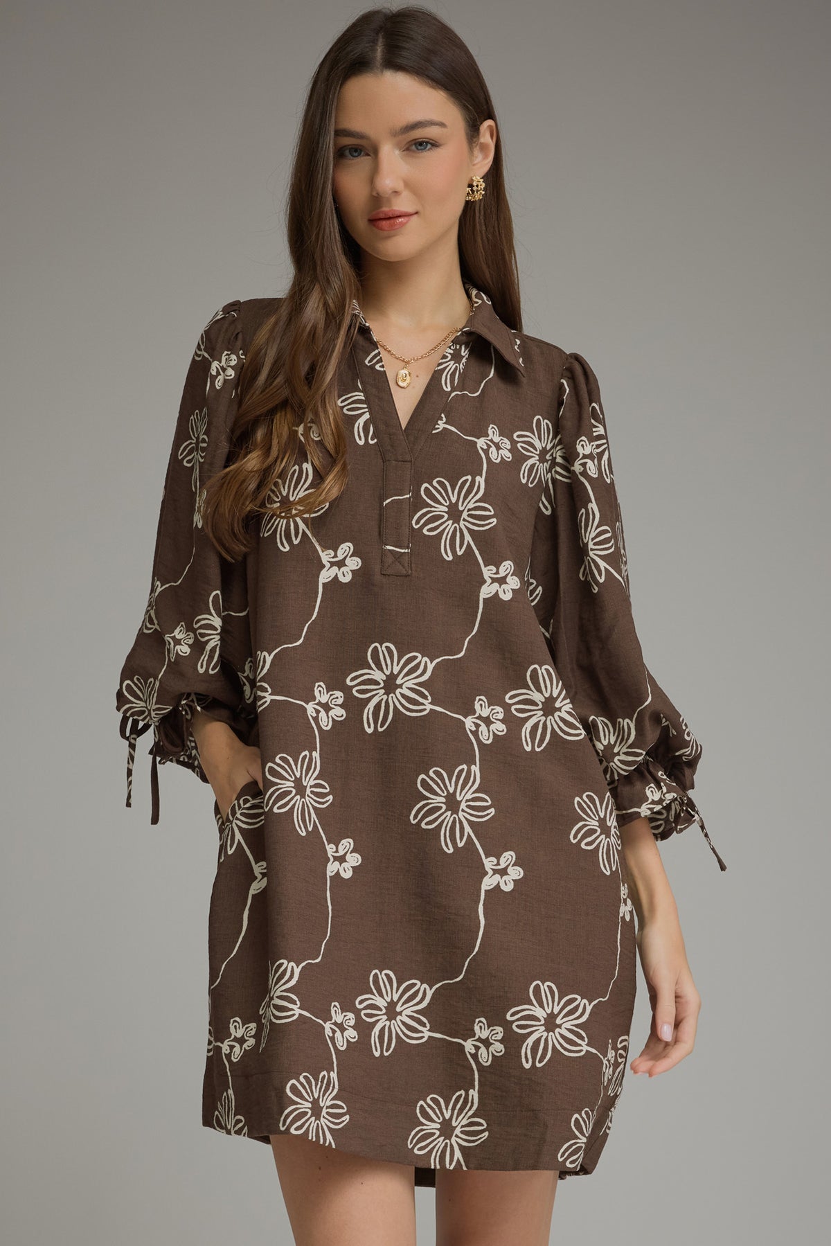 Brown floral balloon-sleeve mini dress, front view