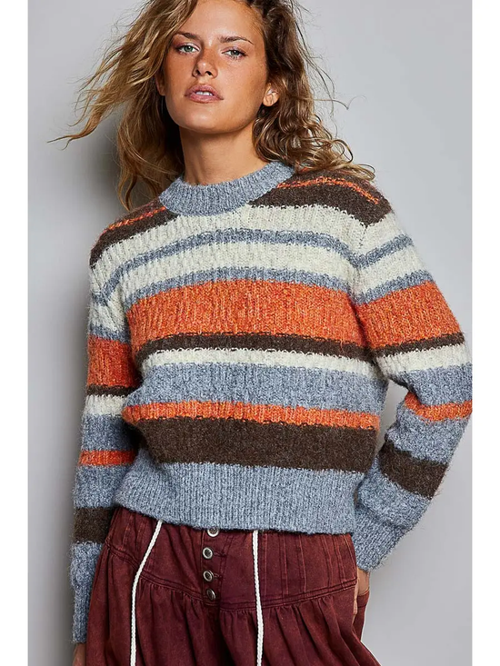 Chunky multicolor striped crew sweater on model, front view