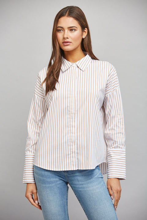 Model wearing tan-and-white striped button-down shirt