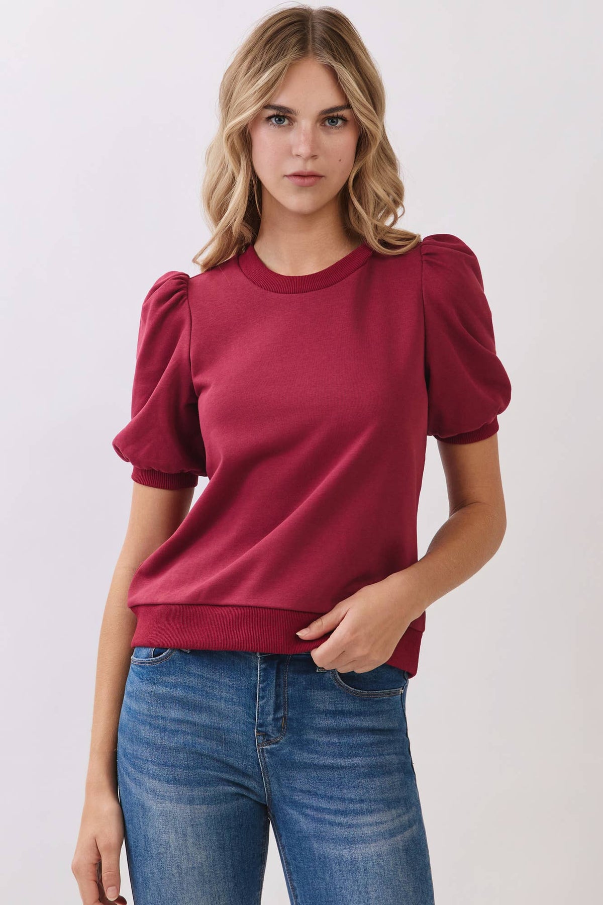 Red puff-sleeve cotton knit top by TCEC, detail view