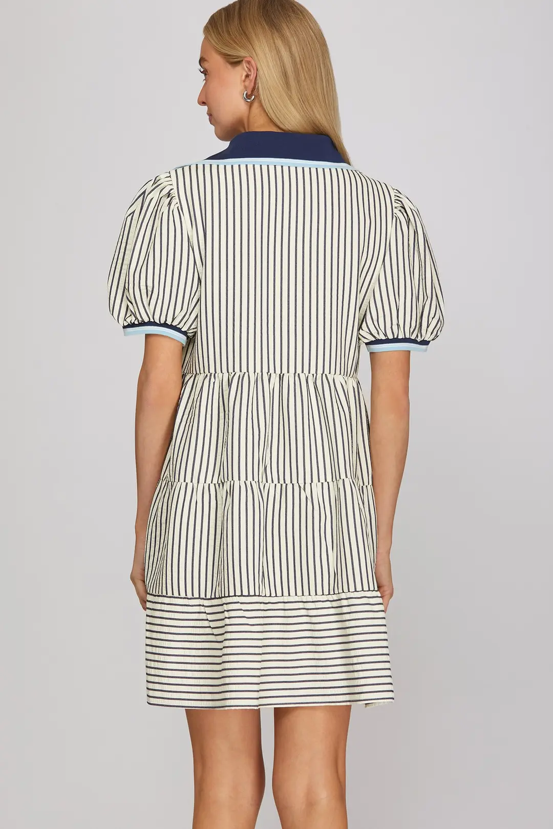Front and skirt detail on navy striped mini dress