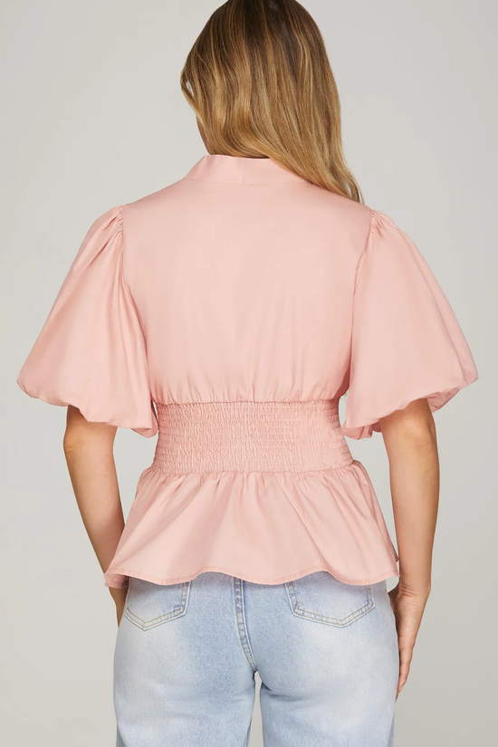 Pink smocked zip-front top side view