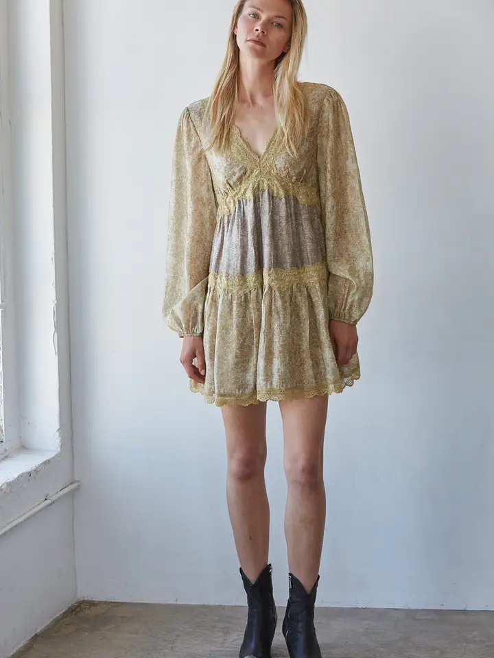 Model wearing mustard floral lace-trim mini dress