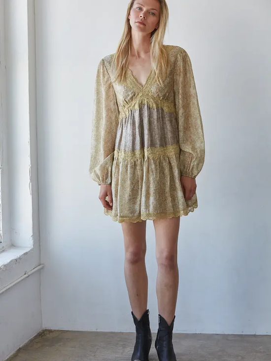 Model wearing mustard floral lace-trim mini dress