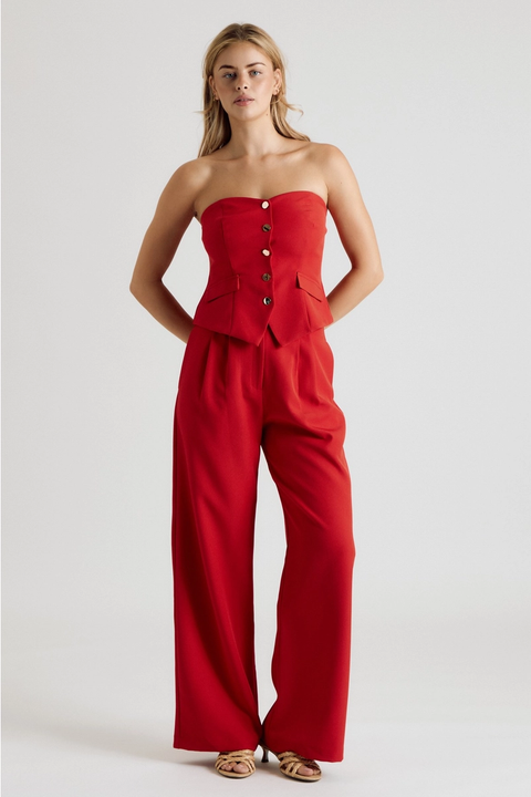Red strapless button-front vest top styled with matching trousers