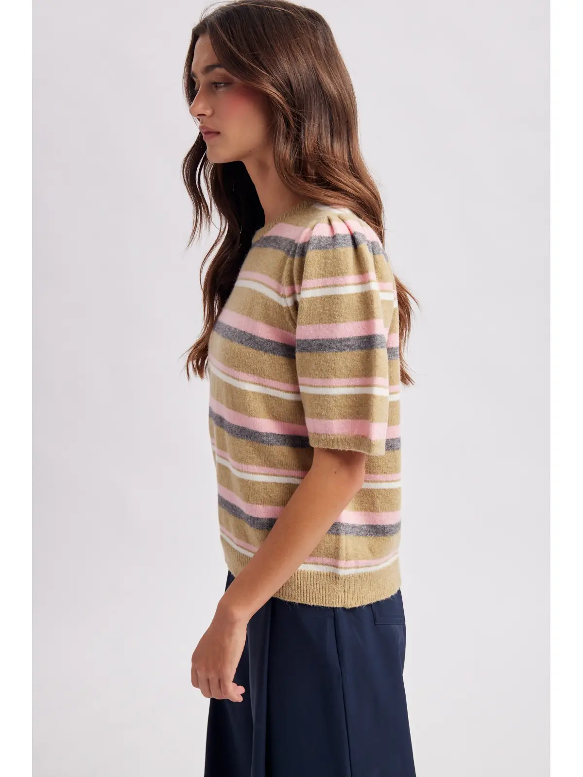 Striped knit top with pink gray and ivory accents, side view