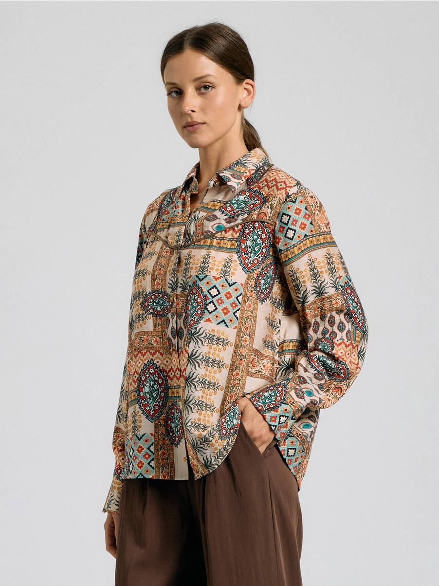 Angled view of relaxed patchwork-print shirt