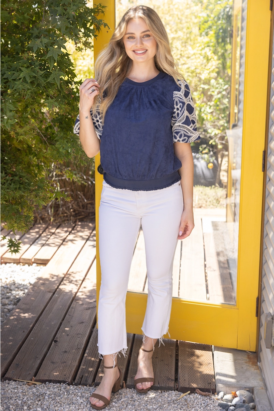 Dark blue crochet-sleeve suede top front view