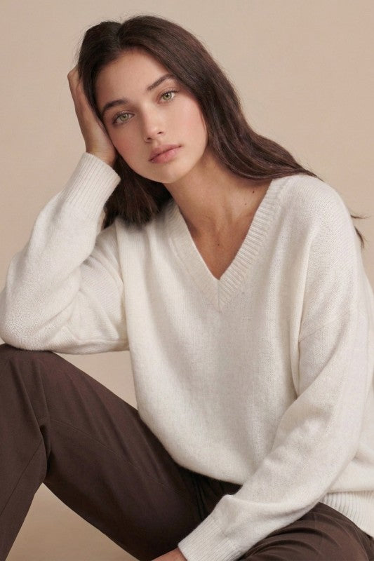 Ivory plush V-neck sweater styled front view