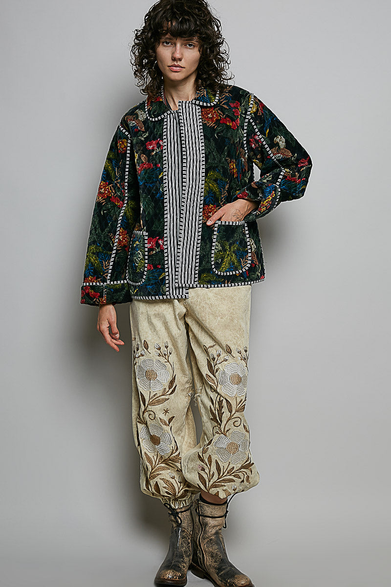 Black floral quilted jacket styled with relaxed pants
