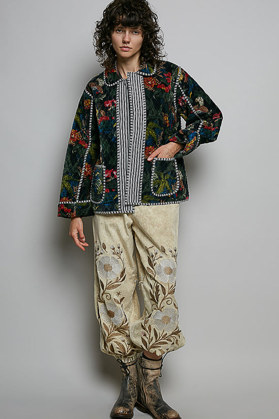 Black floral quilted jacket styled with relaxed pants