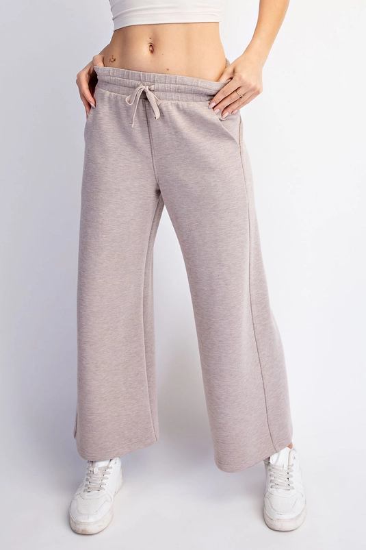 Cropped wide-leg pants showing front seam detail and pockets
