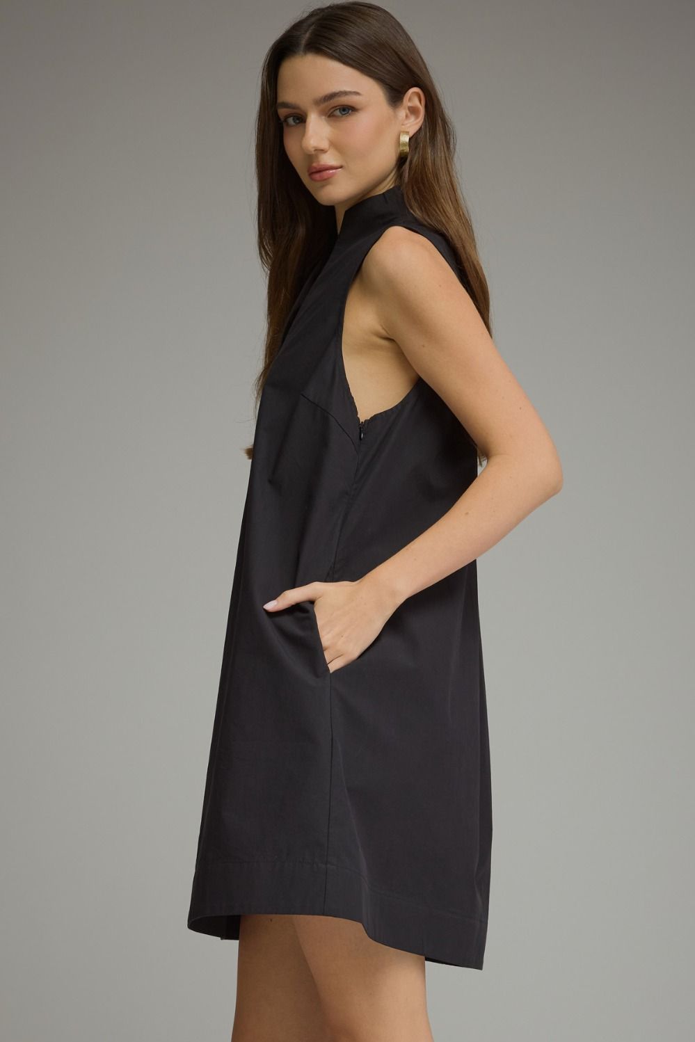 Black sleeveless split-neck mini dress with a stand collar and relaxed shift silhouette