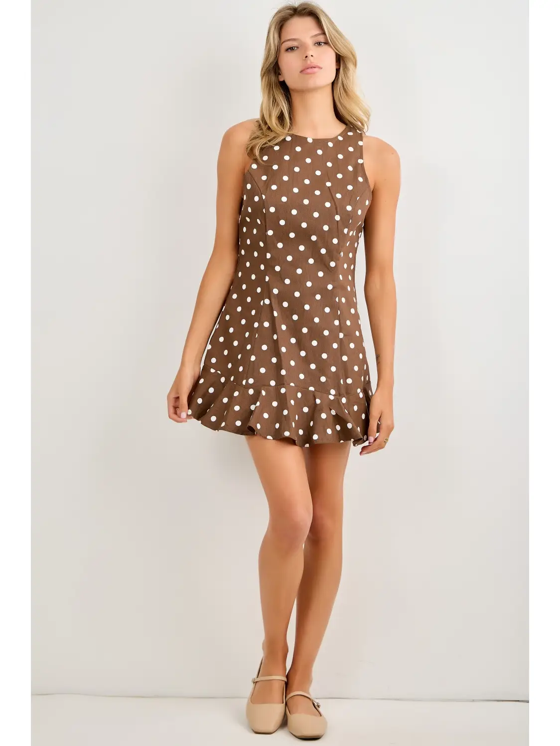Brown and white polka-dot ruffle-hem mini dress, front view