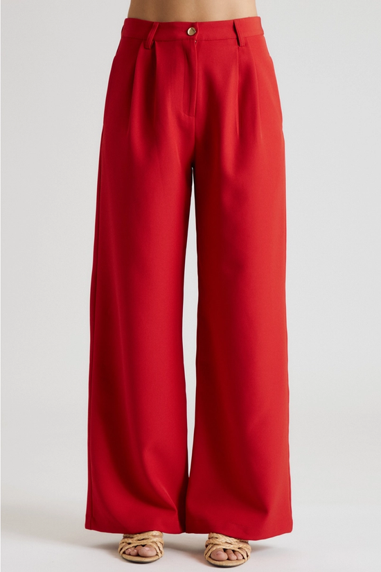 Front view of red high-rise pleated wide-leg trousers