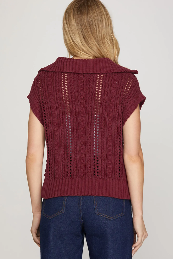 Red pointelle sweater knit texture detail