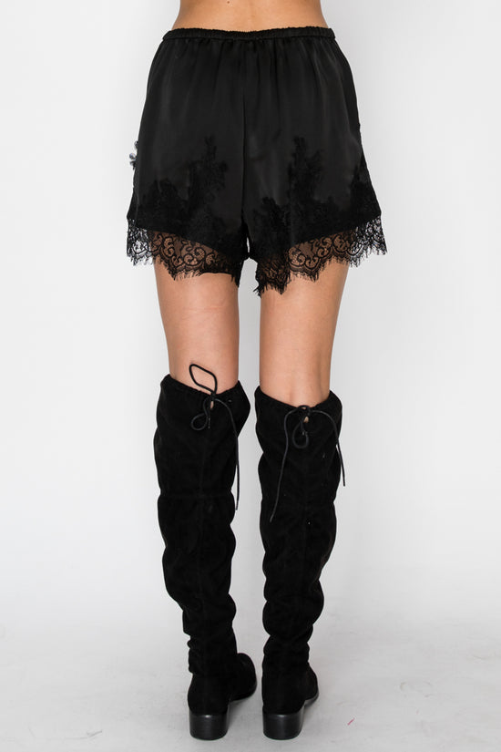 Black boxer-inspired shorts with delicate lace detailing