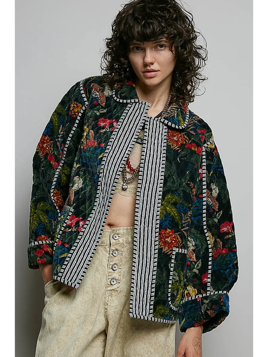 Black floral quilted open-front jacket on model, front view