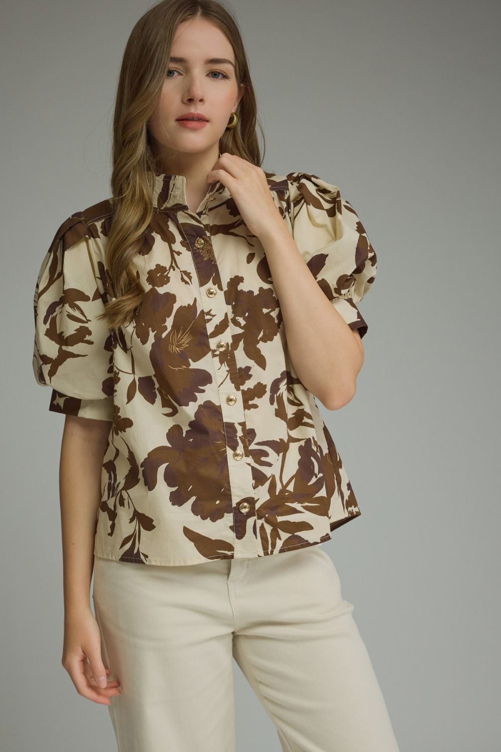 Brown floral puff-sleeve top with a ruffle-trim mock neckline and button-front detail