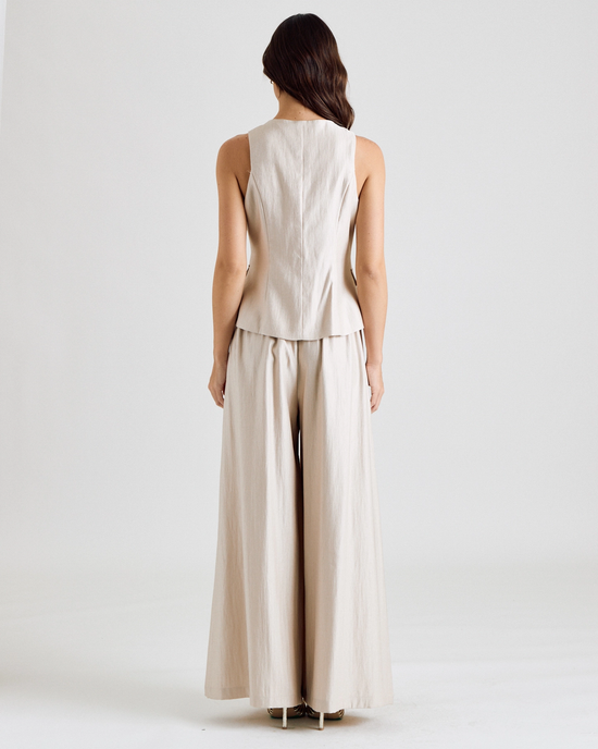 Button-front vest showing its clean tailored back