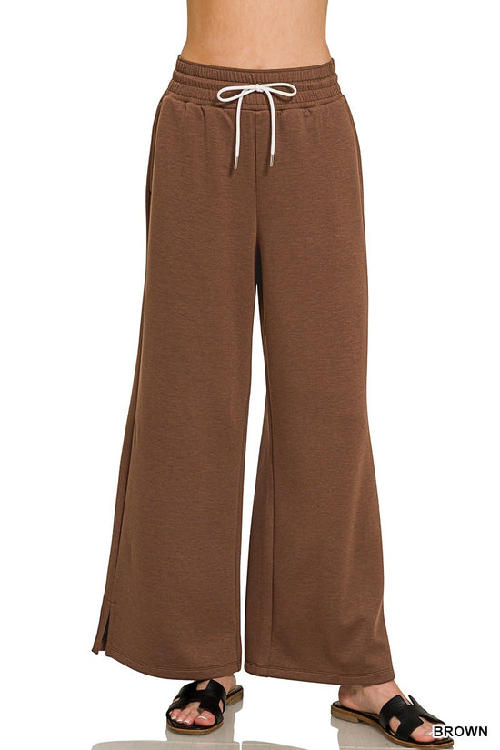 Brown cloud-fleece drawstring pants with a wide-leg fit