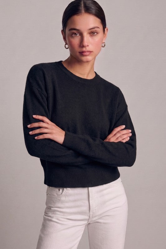 Black essential crewneck sweater styled front view