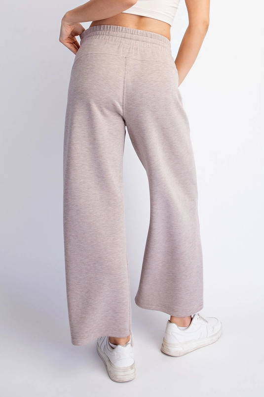Taupe pull-on pants styled on a model