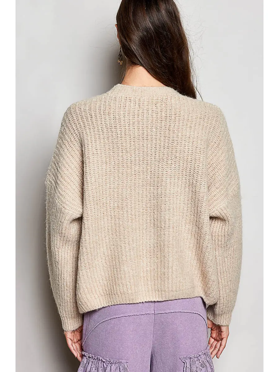 Tan V-neck cardigan on model, back view