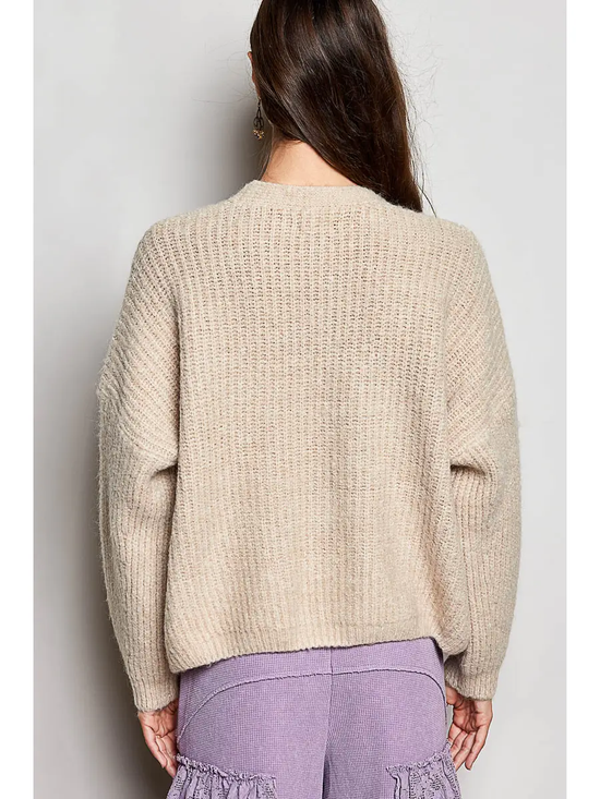 Tan V-neck cardigan on model, back view