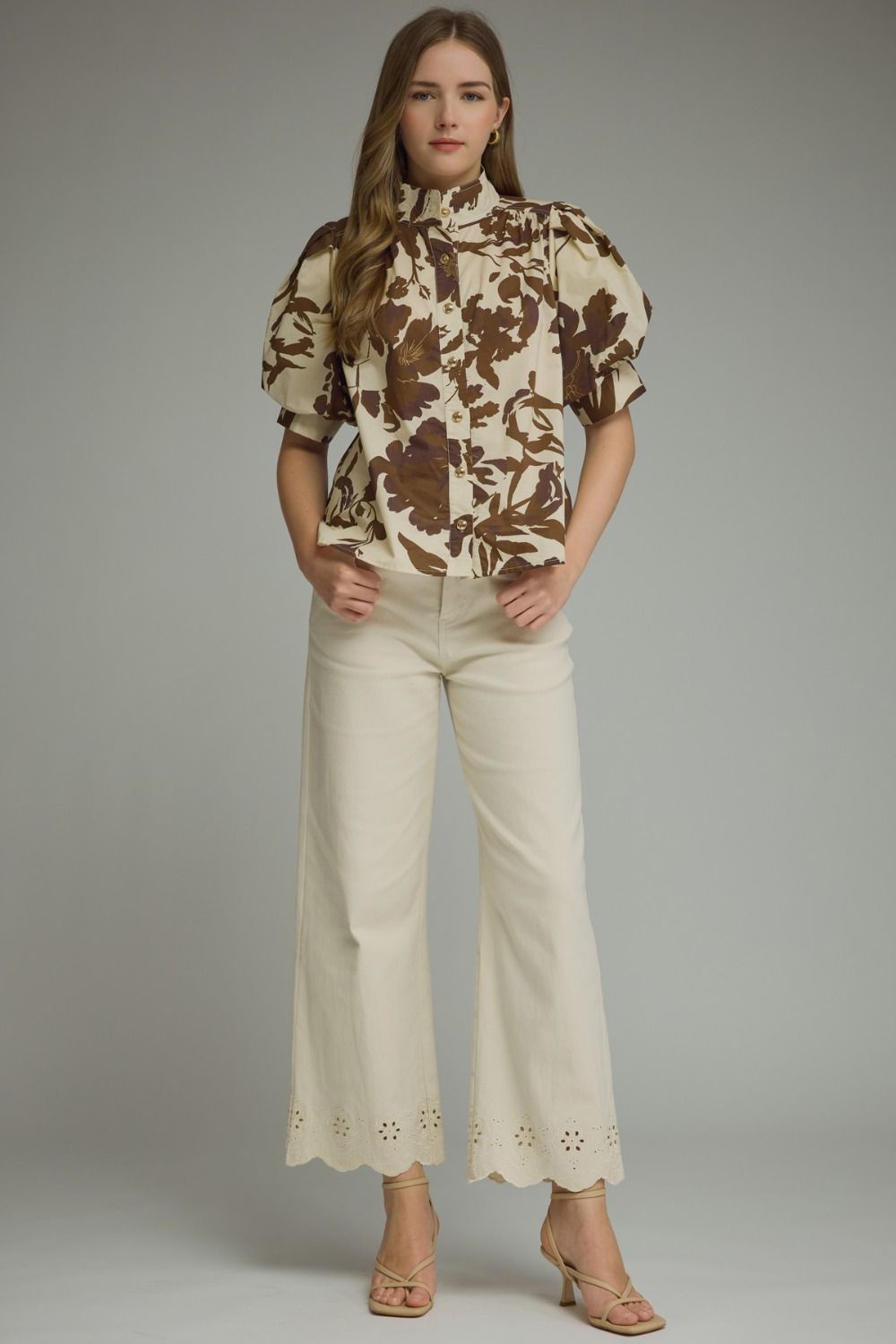 Brown floral puff-sleeve top with a ruffle-trim mock neckline and button-front detail