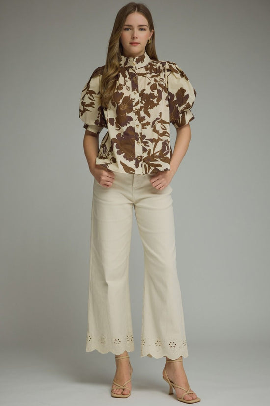 Brown floral puff-sleeve top with a ruffle-trim mock neckline and button-front detail